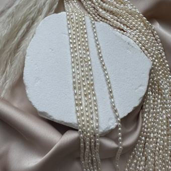 Жемчуг натуральный "Рис", 2,5*3 мм, AAA, нить